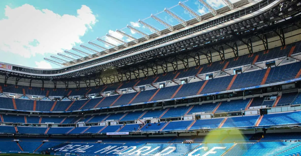 The interior of the Santiago Bernabéu with a guide, a football museum in Madrid, Spain