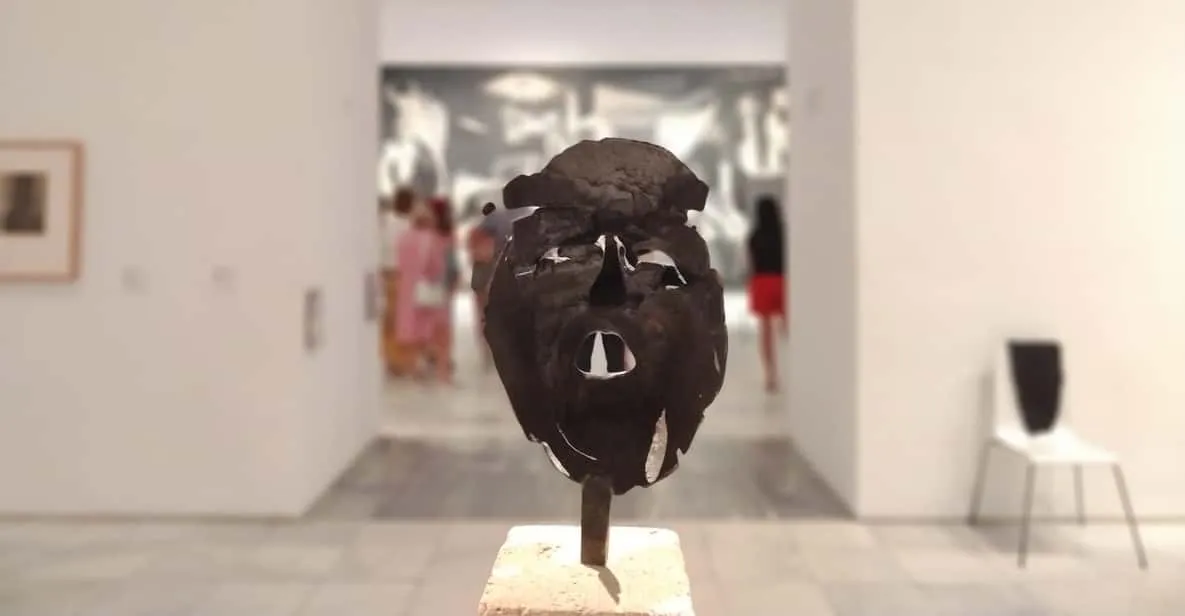 A small guided group viewing modern art at the Reina Sofía, a must-see museum in Madrid, Spain